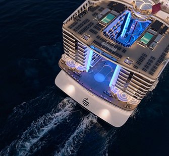 Aerial view of a modern cruise ship with illuminated pools and lounges | MSC Cruises Aerial view of a modern cruise ship with illuminated pools and lounges | MSC Cruises