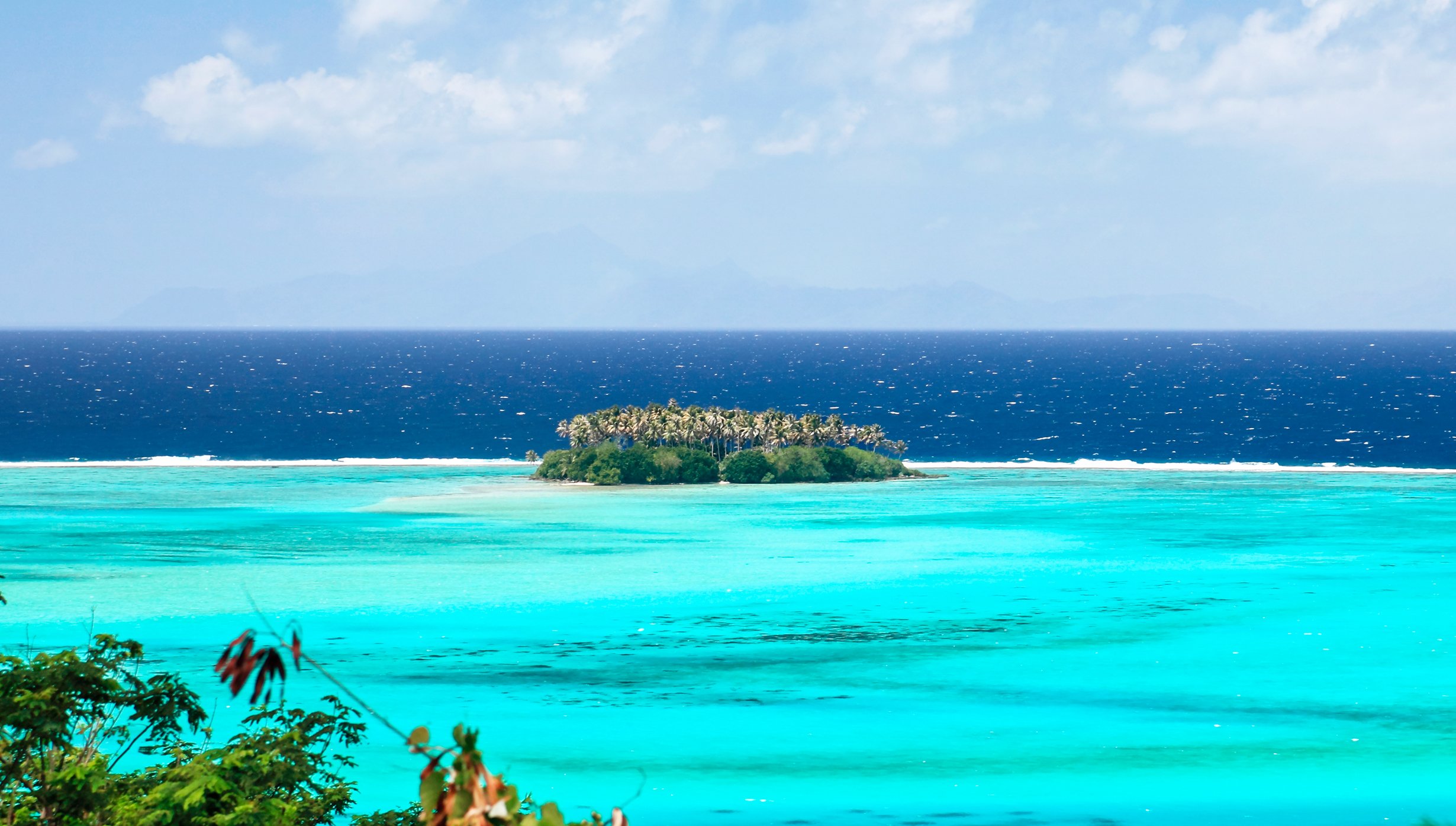 A small tropical island surrounded by turquoise waters and a deep blue ocean | MSC Cruises A small tropical island surrounded by turquoise waters and a deep blue ocean | MSC Cruises