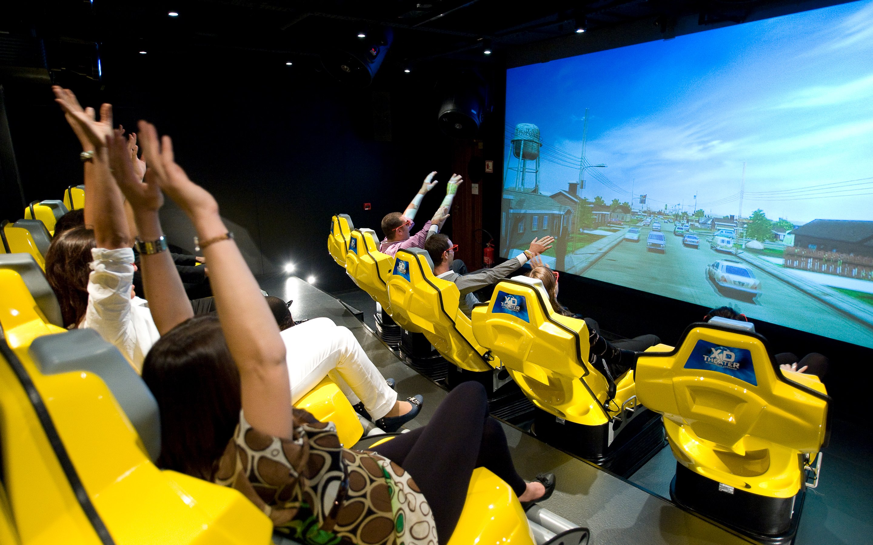 Guests enjoying a thrilling XD cinema experience onboard | MSC Cruises Guests enjoying a thrilling XD cinema experience onboard | MSC Cruises