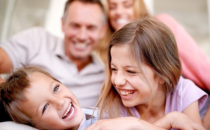 A family relaxing together in a cozy setting onboard | MSC Cruises A family relaxing together in a cozy setting onboard | MSC Cruises